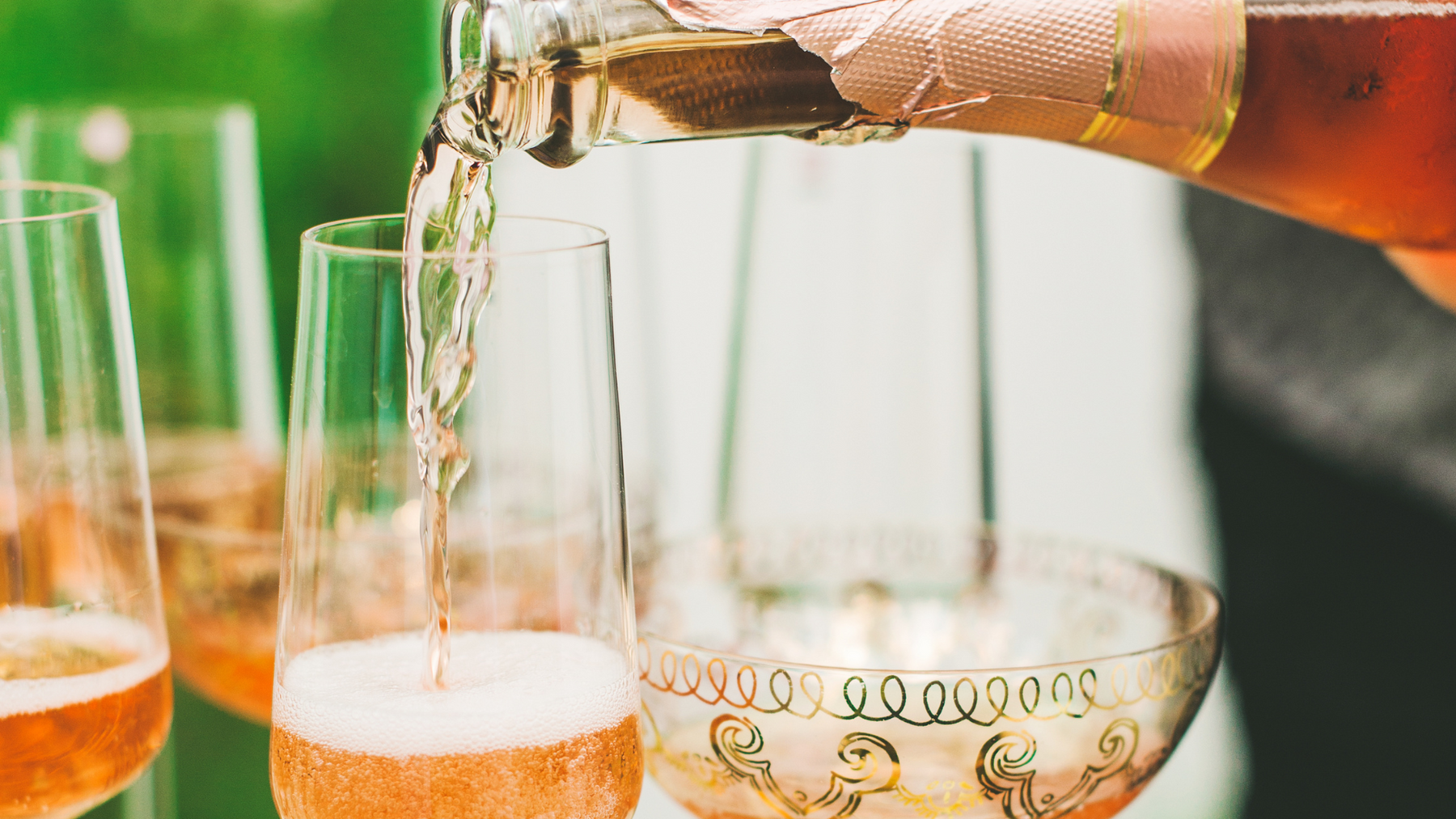 Sparkling Rosé poured into wine glasses.