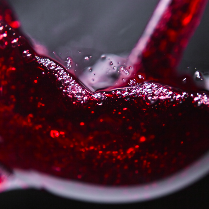 Red wine poured in a wine glass
