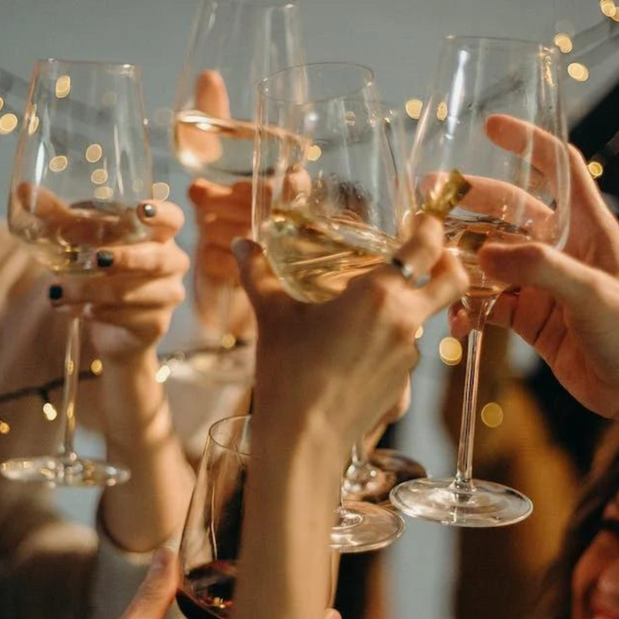 Group of friends toasting champagne.