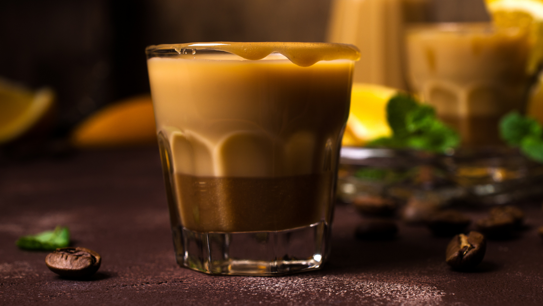 A glass of golden cappuccino.